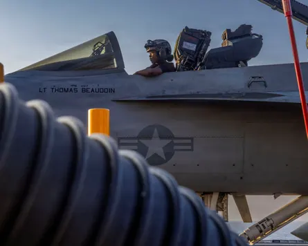 A man sitting in the cockpit of fighter jet