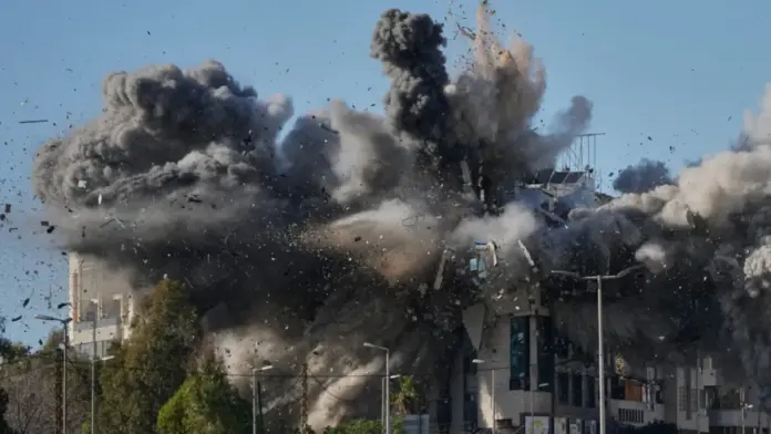 Smoke rises after an Israeli airstrike hits a building near the airport road in Beirut, Lebanon