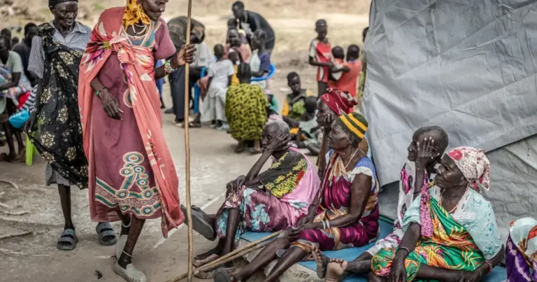 Elderly members of the Nuer community, uprooted by the conflict in Jonglei State, attend a community health session amid shortages of medical supplies in the POC IDP Camp in Bor, Jonglei State, on February 16, 2026. South Sudan gained independence in 2011 but quickly descended into civil war between rival generals, Salva Kiir and Riek Machar. A power-sharing deal in 2018 brought relative peace, with Kiir as president and Machar his deputy. But the deal was never fully implemented, their forces n