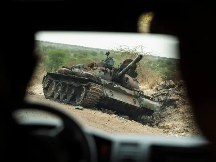FILE - A destroyed tank is seen by the side of the road south of Humera, in an area of western Tigray, annexed by the Amhara region during the ongoing conflict, in Ethiopia, May 1, 2021. (AP Photo/Ben Curtis, File)