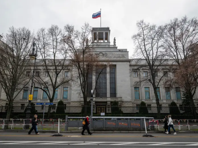 People walking past the Russian embassy in Berlin