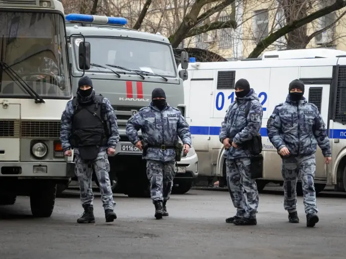 Police officers walk near the Basmanny District Court in Moscow