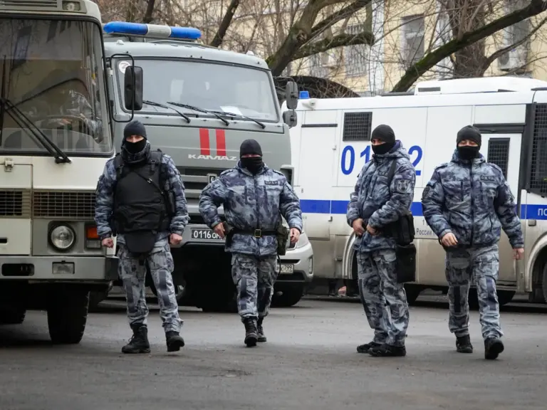 Police officers walk near the Basmanny District Court in Moscow