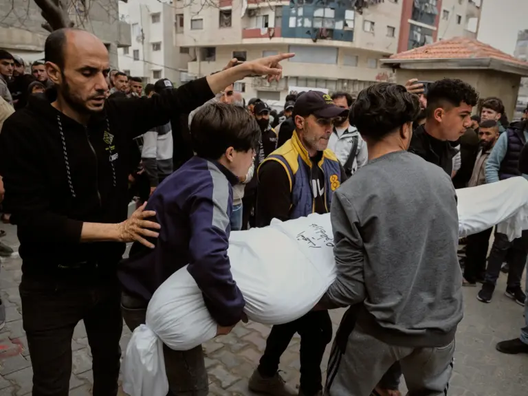Mourners carry the bodies of Palestinians