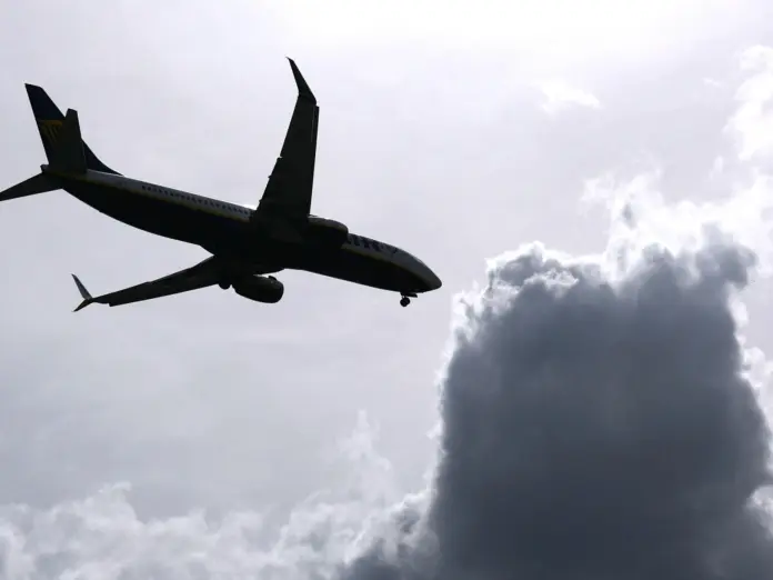 An airplane and some dark clouds