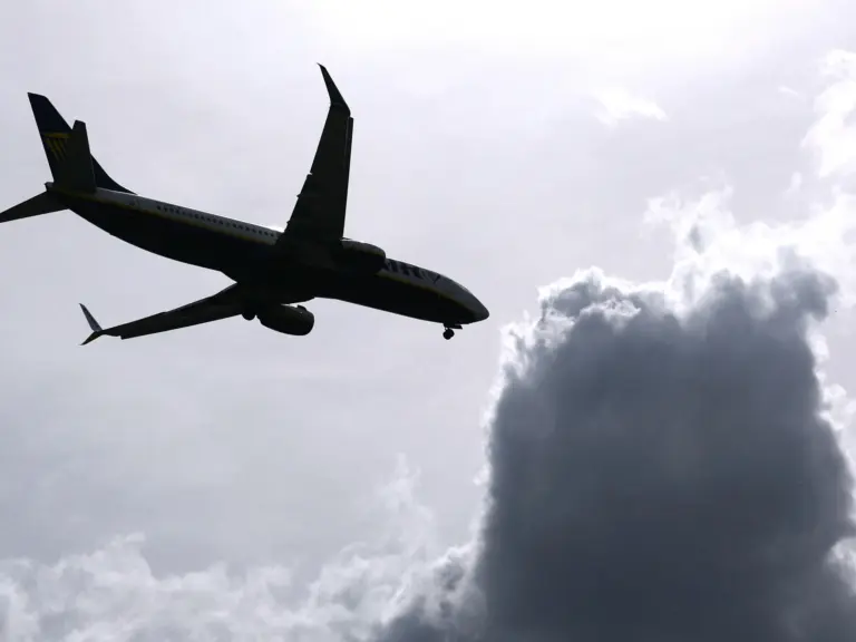 An airplane and some dark clouds