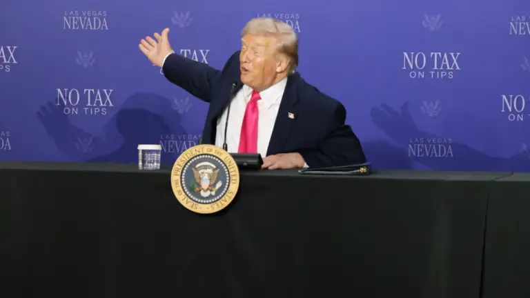 US President Donald Trump speaks at a podium.