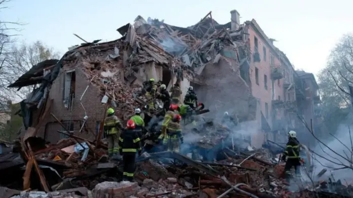 State Emergency Service of Ukraine Rescue workers searching the ruins of a collapsed building in Ukraine