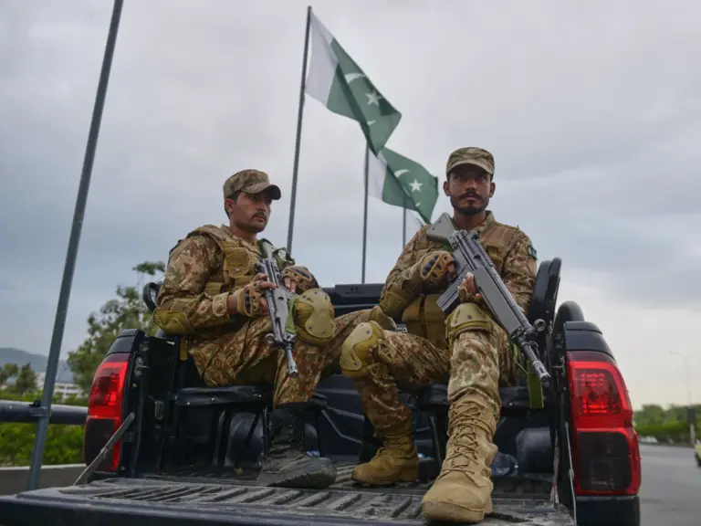 Army soldiers take positions in an overhead bridge to ensure security in Islamabad, Pakistan, Friday, April 24, 2026. (AP Photo/M.A. Sheikh)