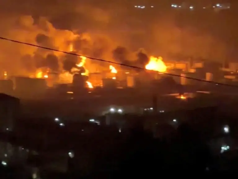 Fire and smoke rise at an oil refinery near the Tuapse port, Russia