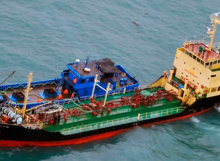 FILE - This Feb. 16, 2018, file photo released by Japan's Ministry of Defense shows what it says North Korean-flagged tanker Yu Jong 2, bottom, and Min Ning De You 078 lying alongside in the East China Sea. Diplomats say Russia has asked for additional time to investigate U.S. allegations that North Korea is smuggling refined petroleum products into the country beyond the quota of 500,000 barrels per year allowed under U.N. sanctions. (Japan's Ministry of Defense via AP, File)
