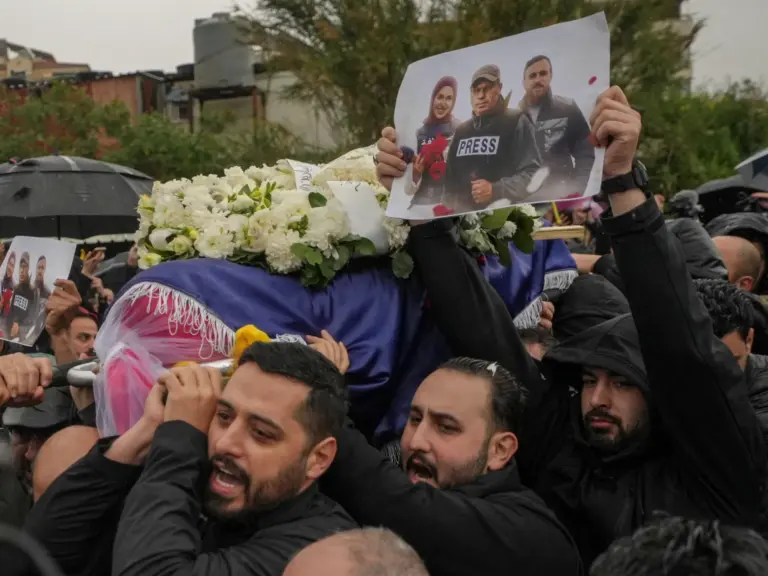 Relatives and friends carry the coffin of Mohammed Ftouni, during the funeral of Lebanese journalists, Al Mayadeen reporter Fatima Ftouni, cameraman Mohammed Ftouni and Al Manar reporter Ali Shaib, who were killed by a targeted Israeli strike, amid escalating hostilities between Israel and Hezbollah, as the U.S.-Israeli conflict with Iran continues, in Choueifat, Lebanon, March 29, 2026. REUTERS/Mohammad Yassine