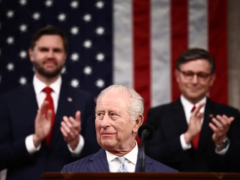 US Vice President JD Vance and House Speaker Mike Johnson applaud as Britain's King Charles III arrives to address a Joint Meeting of Congress in the House Chamber at the US Capitol in Washington, DC, on April 28, 2026. (Photo by Henry NICHOLLS / POOL / AFP)