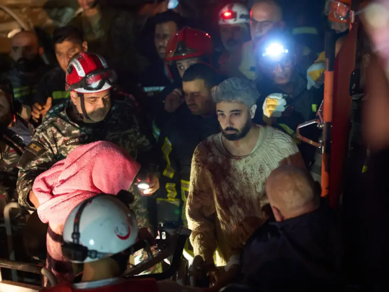 A man who survived an Israeli airstrike is rescued by a firefighter from a destroyed building in central Beirut, Lebanon, Wednesday, April 8, 2026. (AP Photo/Emilio Morenatti)