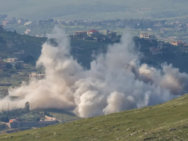 Smoke rising from the hills.