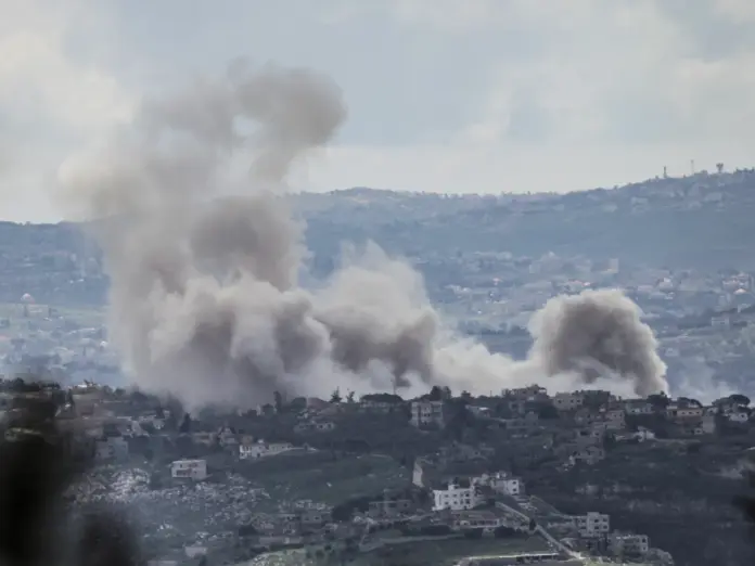 A photograph taken from the southern Lebanese area of Marjayoun shows smoke rising from explosions induced by Israeli military operations in the village of al-Taybeh on March 31, 2026.