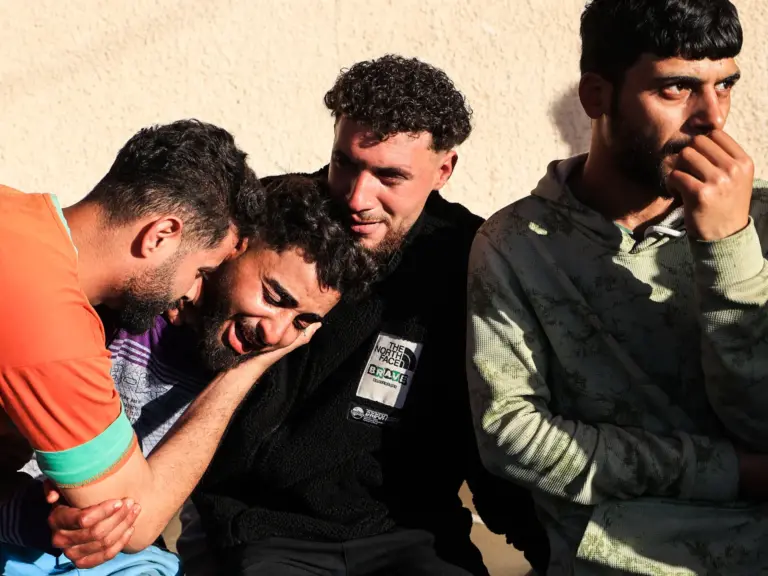 A family member reacts outside the Al-Aqsa Martyrs Hospital in Deir al-Balah, where victims have been brought following an Israeli strike on the Al-Maghazi refugee camp in the central Gaza Strip on April 6, 2026.