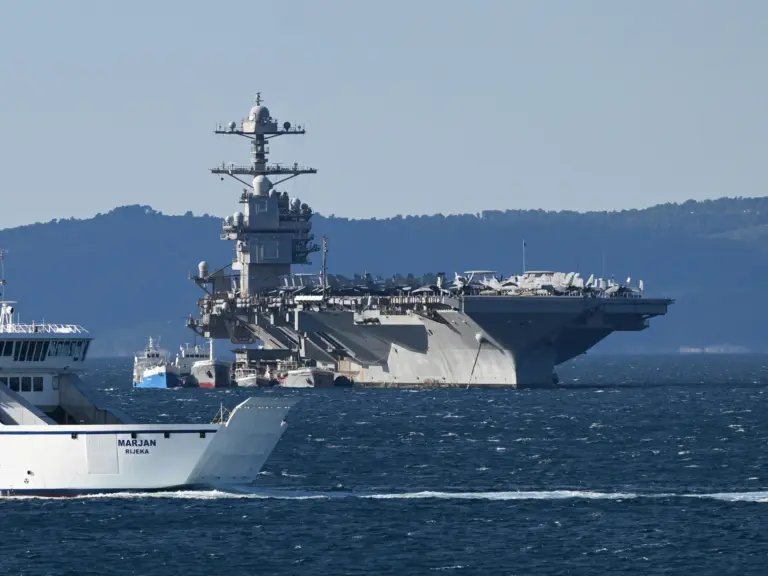 epa12858426 The US Navy aircraft carrier USS Gerald R. Ford (CVN-78) sits anchored in Split, Croatia, 29 March 2026. The ship arrived for repairs following a non-combat fire during operations in the Red Sea. The world's largest carrier, which recently supported Operation Epic Fury, transitioned to the NATO-allied port after a March 12 laundry room fire injured three sailors and damaged sleeping quarters. The vessel remains a centerpiece of US naval power, housing over 5,000 crew members and 75 m