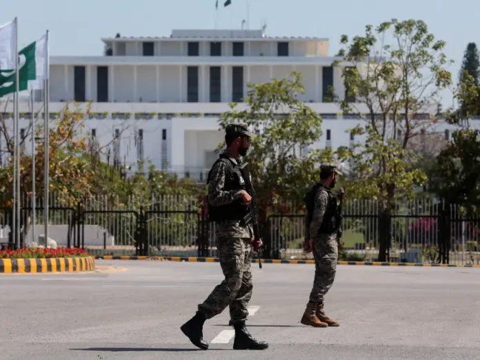 Pakistani Rangers patrol near the president's house.