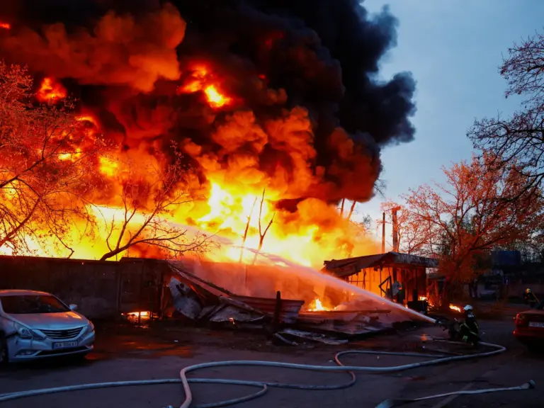 Firefighters work to put out a huge fire.