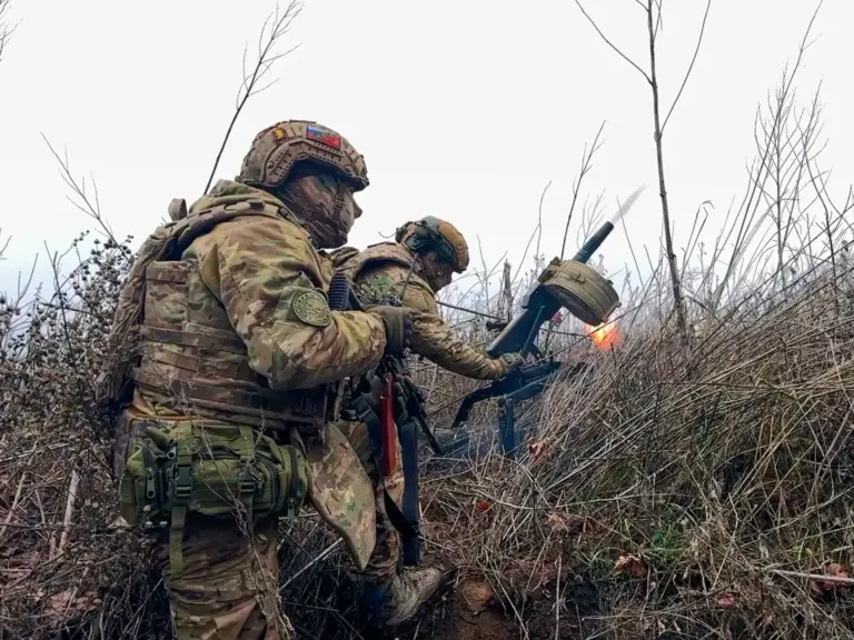 In this image made from video provided by Russian Defense Ministry Press Service on Tuesday, March 31, 2026, Russian soldiers fire a grenade launcher towards Ukrainian positions on an undisclosed location in Ukraine. (Russian Defense Ministry Press Service via AP)