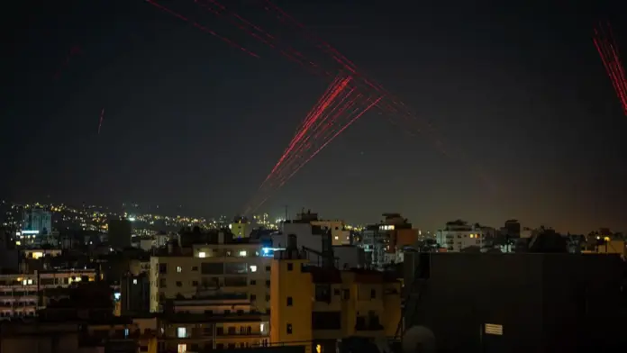 Getty Images Gunfire is fired into the sky from Beirut's southern suburbs in the early hours of April 17, 2026, as residents celebrate the start of a 10-day ceasefire that took effect at midnight.