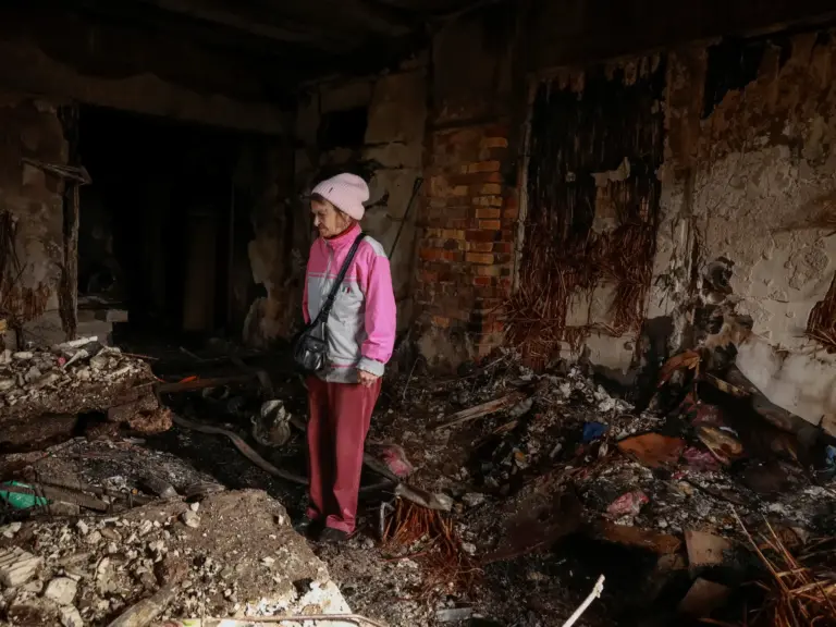 A resident stands in her room in a dormitory hit by a Russian drone strike, amid Russia's attack on Ukraine, in Odesa, Ukraine April 30, 2026. REUTERS/Nina Liashonok TPX IMAGES OF THE DAY